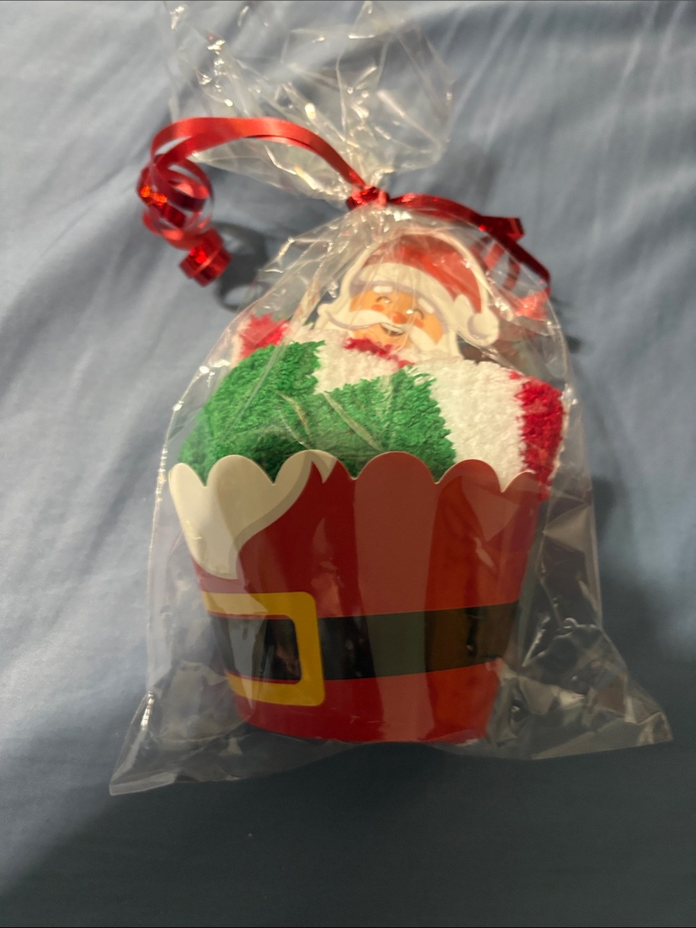 Holiday Santa Cupcake sock Gift - Red, Green, White wrapped and tied with ribbon